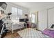 Bright bedroom with large window, modern desk setup, and plush shag rug at 10180 Delray Beach Ave # 202, Las Vegas, NV 89129