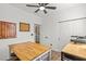 Multipurpose room with modern decor, light wood table, and storage; perfect for crafting or hobbies at 10180 Delray Beach Ave # 202, Las Vegas, NV 89129