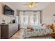 Charming bedroom with natural light, modern furniture, soft rug, and a stylish television mounted on the wall at 10180 Delray Beach Ave # 202, Las Vegas, NV 89129