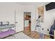 Inviting bedroom with ample natural light, adjacent to a stylishly decorated hallway at 10180 Delray Beach Ave # 202, Las Vegas, NV 89129