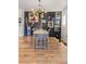 Well-lit dining room showcases modern lighting, decorative wall, and sleek wood flooring at 10180 Delray Beach Ave # 202, Las Vegas, NV 89129
