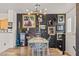 Bright dining room features decorative wall art, modern lighting, and wood floors at 10180 Delray Beach Ave # 202, Las Vegas, NV 89129