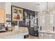 Dining area boasts a decorative wall, granite countertop, and wood flooring at 10180 Delray Beach Ave # 202, Las Vegas, NV 89129