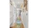 Bright hallway adorned with decorative wall panels, built-in shelving, and wood flooring at 10180 Delray Beach Ave # 202, Las Vegas, NV 89129