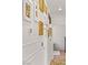 Hallway featuring decorative wall panels, sconce lighting, and beautiful wood flooring at 10180 Delray Beach Ave # 202, Las Vegas, NV 89129