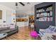 Inviting living room flows into kitchen, complete with hardwood floors, comfortable seating, and stylish furnishings at 10180 Delray Beach Ave # 202, Las Vegas, NV 89129