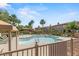 Community pool area with lounge chairs, palm trees, and well-maintained landscaping, perfect for relaxation at 10180 Delray Beach Ave # 202, Las Vegas, NV 89129