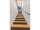 Modern staircase with wooden treads leads to the upper level of this stylish home at 10180 Delray Beach Ave # 202, Las Vegas, NV 89129