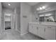 Modern bathroom featuring dual sinks, quartz countertops and a glass enclosed shower at 1040 Via Panfilo Ave, Henderson, NV 89011