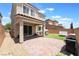 Lovely backyard featuring a covered patio, pavers, and manicured lawn perfect for relaxation at 10829 Crestview Pointe Ave, Las Vegas, NV 89166
