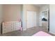 Bedroom featuring plush carpet, closet with sliding doors, and a chest of drawers at 10829 Crestview Pointe Ave, Las Vegas, NV 89166
