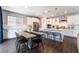 Eat-in kitchen has large island with seating and a table near the window at 10829 Crestview Pointe Ave, Las Vegas, NV 89166