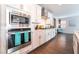 Modern kitchen includes stainless steel microwave and oven, and white cabinets at 10829 Crestview Pointe Ave, Las Vegas, NV 89166