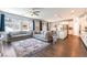 Open-concept living area with modern furnishings and a seamless flow to the kitchen at 10829 Crestview Pointe Ave, Las Vegas, NV 89166