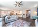 Open-concept living area with modern furnishings and a seamless flow to the kitchen at 10829 Crestview Pointe Ave, Las Vegas, NV 89166