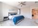 Comfortable main bedroom featuring carpet floors, a ceiling fan, and cool paint at 10829 Crestview Pointe Ave, Las Vegas, NV 89166