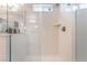 Clear glass shower enclosure featuring a built in shelf and brushed nickel hardware at 10829 Crestview Pointe Ave, Las Vegas, NV 89166