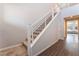 Modern staircase with sleek railings and wood flooring leading to the upper level at 10829 Crestview Pointe Ave, Las Vegas, NV 89166