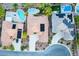 Aerial view of homes with pools and solar panels at 11569 Velicata Ct, Las Vegas, NV 89138