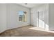Bright bedroom featuring a window with blinds and a closet with sliding doors at 11569 Velicata Ct, Las Vegas, NV 89138