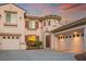 Charming two-story home with terracotta roof, three-car garage and well-maintained landscaping at 11569 Velicata Ct, Las Vegas, NV 89138