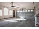 Spacious garage with windows, an automatic door and plenty of room for parking at 11569 Velicata Ct, Las Vegas, NV 89138