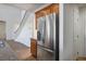 Kitchen with stainless steel fridge, oak cabinets and granite countertops at 11569 Velicata Ct, Las Vegas, NV 89138