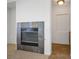 Stone fireplace in a carpeted living room at 11569 Velicata Ct, Las Vegas, NV 89138