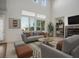 Bright living room with lots of natural light, high ceilings, and modern decor at 11569 Velicata Ct, Las Vegas, NV 89138