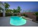 Backyard swimming pool with waterfall feature and easy access steps at 11569 Velicata Ct, Las Vegas, NV 89138