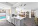 Open-concept kitchen featuring a central island and a view of the backyard swimming pool at 1589 Silver Mesa Way, Las Vegas, NV 89169
