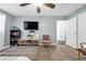 Inviting living room with tile flooring, decorative rug, and comfortable seating area at 1589 Silver Mesa Way, Las Vegas, NV 89169