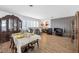 Elegant dining room and living area featuring beautiful wood floors and sophisticated decor at 1589 Silver Mesa Way, Las Vegas, NV 89169