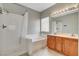 Bright bathroom featuring a shower, soaking tub, and dual sink vanity at 177 Shaded Peak St, Henderson, NV 89012