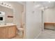 Bathroom featuring a vanity, toilet, and tiled shower at 177 Shaded Peak St, Henderson, NV 89012