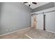 Bedroom featuring a sliding barn door to the closet at 177 Shaded Peak St, Henderson, NV 89012