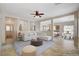Inviting living room showcasing an open layout to the kitchen and dining area at 177 Shaded Peak St, Henderson, NV 89012