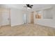 Neutral living room featuring tile flooring, neutral walls, and an open layout at 177 Shaded Peak St, Henderson, NV 89012