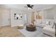Inviting living room featuring tile flooring, neutral walls, and an open layout at 177 Shaded Peak St, Henderson, NV 89012