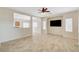A spacious living room showcasing tile flooring, neutral walls, and an open concept design at 177 Shaded Peak St, Henderson, NV 89012