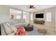 Comfortable living room with tile flooring and an open concept design to kitchen at 177 Shaded Peak St, Henderson, NV 89012