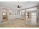 Bright living room features neutral walls, tile flooring, and open-concept design at 177 Shaded Peak St, Henderson, NV 89012