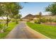 Scenic walking path with mountain views, lush greenery, and well-maintained landscaping at 177 Shaded Peak St, Henderson, NV 89012