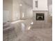 Open-concept living area featuring a fireplace and staircase at 2104 Inverness Dr, Henderson, NV 89074