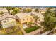 A lush backyard featuring a small lawn, palm trees, and patio perfect for outdoor lounging and entertaining at 2199 Timescape Ct, Las Vegas, NV 89123