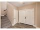 Bright entryway with a double-door entrance and staircase at 2199 Timescape Ct, Las Vegas, NV 89123