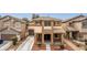 Charming two-story home featuring a cozy front porch and a well-maintained landscape at 2199 Timescape Ct, Las Vegas, NV 89123