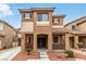 Inviting two-story home with a covered porch and well-manicured front yard at 2199 Timescape Ct, Las Vegas, NV 89123