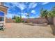 Rock-landscaped backyard fully fenced for privacy with mature trees at 2445 Sturrock Dr, Henderson, NV 89044