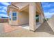 Covered patio and access door in rock-landscaped backyard at 2445 Sturrock Dr, Henderson, NV 89044